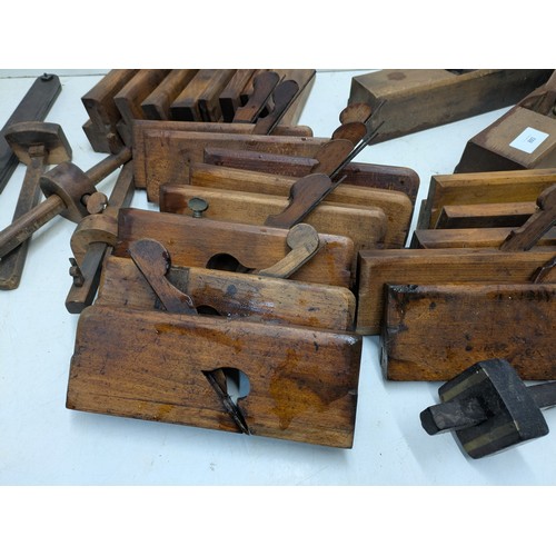 893 - A large selection of vintage wood hand planes and mortice and tenon measures