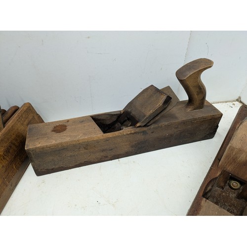 893 - A large selection of vintage wood hand planes and mortice and tenon measures