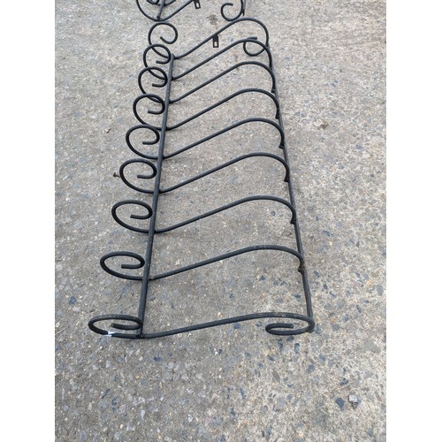 273 - A pair of wrought iron wall baskets