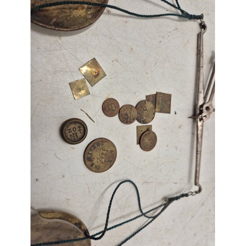 1024 - A set of vintage brass weighing scales with a selection of weights