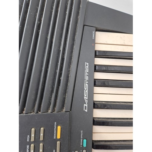 1404 - A Yamaha model psr-48 portable keyboard