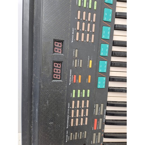 1404 - A Yamaha model psr-48 portable keyboard