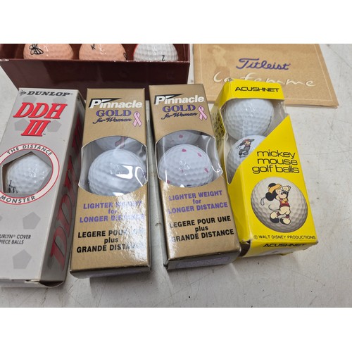 2028 - A selection of various golf balls in original packaging