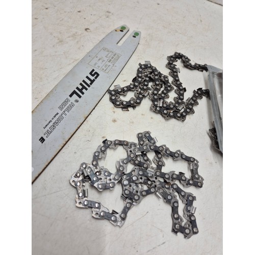 1723 - A selection of chains and a bar for a Stihl chainsaw