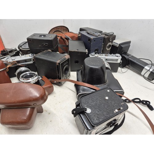 1062 - A large selection of vintage cameras including box cameras, Kodak, ensign, etc