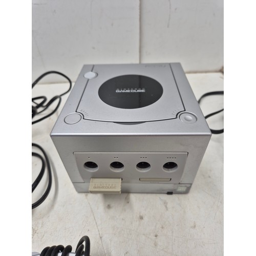 1458 - A Nintendo GameCube console with controller and cables in a limited edition silver colour