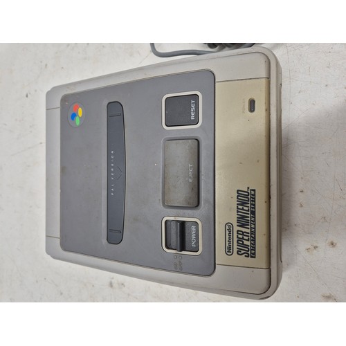 1457 - A Nintendo SNES console with controller