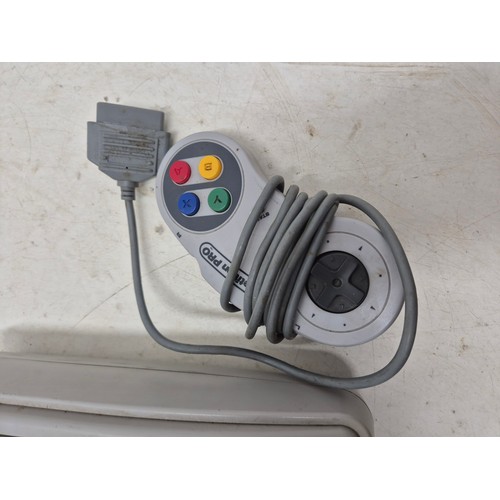 1457 - A Nintendo SNES console with controller