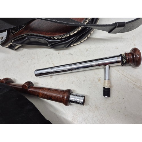 2071 - A set of black and silver bagpipes on carry case