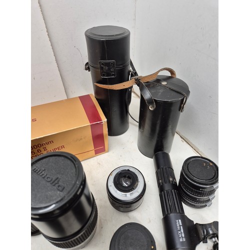 1061 - A large selection of various camera lenses including Minolta, Osawa, etc