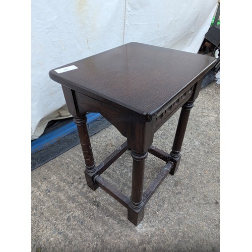 465 - A small oak corner table