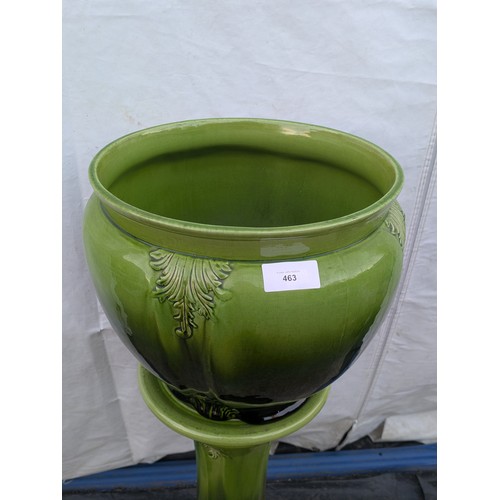 463 - A porcelain plant pot with matching green vase stand