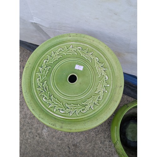 463 - A porcelain plant pot with matching green vase stand