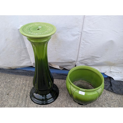 463 - A porcelain plant pot with matching green vase stand