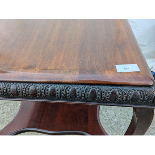 461 - An antique mahogany table with cabrio legs and horseshoe carvings