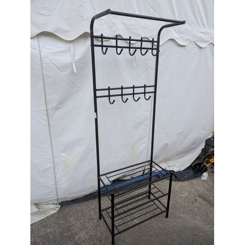 606 - A metal clothes and shoe rack