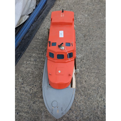 2011 - A RC model lifeboat on a wood stand