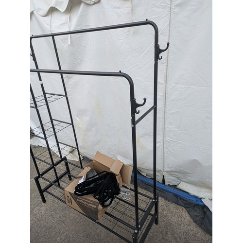 604 - A metal clothes and shoe rack, with a selection of clothes hangers