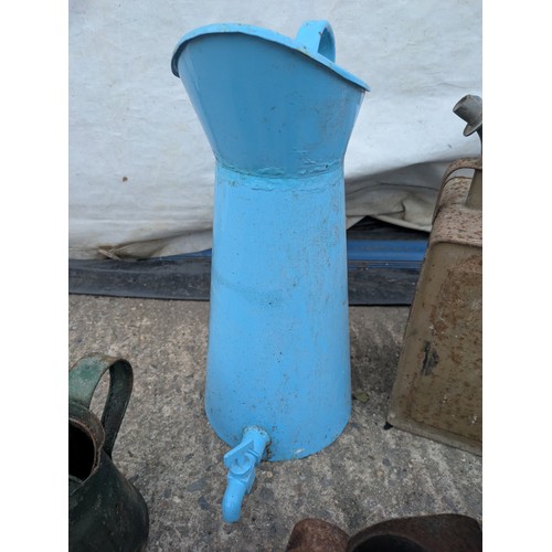 1006 - Selection of various oil and paraffin cans, including one Esso blue can.