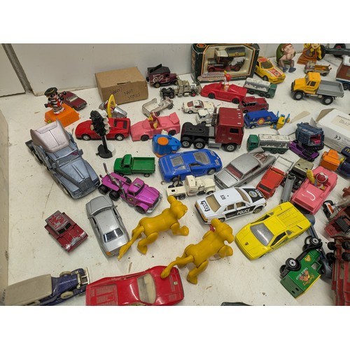 2053 - A large selection of various die cast cars and other toys, including lledo, politoys, etc