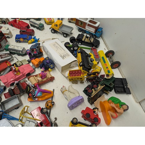 2053 - A large selection of various die cast cars and other toys, including lledo, politoys, etc