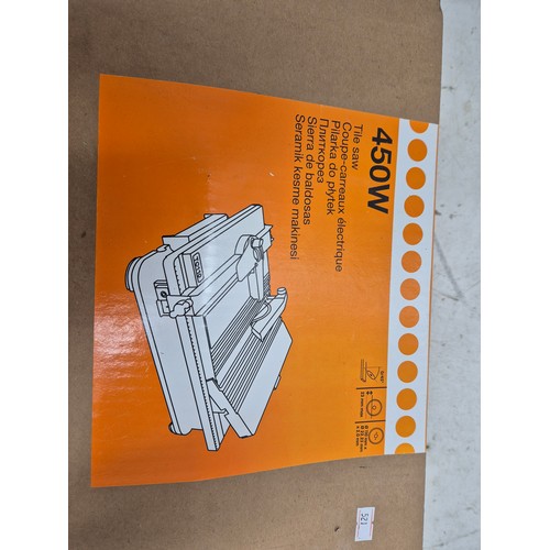 1729 - A 450w tile saw in box