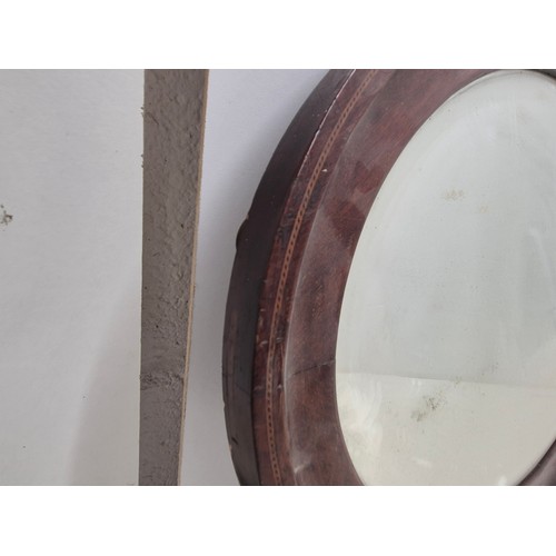 639 - A nice mahogany verniered and inlaid oval wall mounted mirror