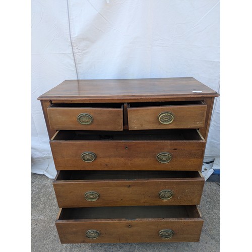 473 - An early 20th century Mahogany graduating chest of drawers with ornate brass handles - in need of ge... 