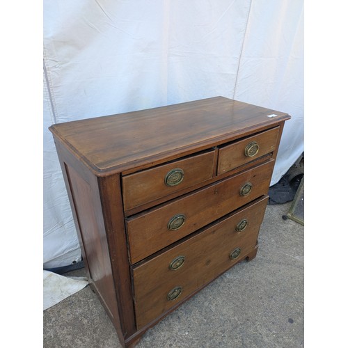 473 - An early 20th century Mahogany graduating chest of drawers with ornate brass handles - in need of ge... 