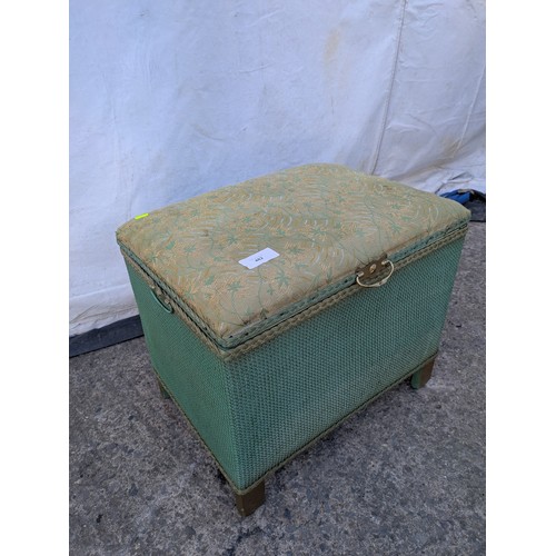 482 - A wicker storage box with a padded Florally upholstered seated top