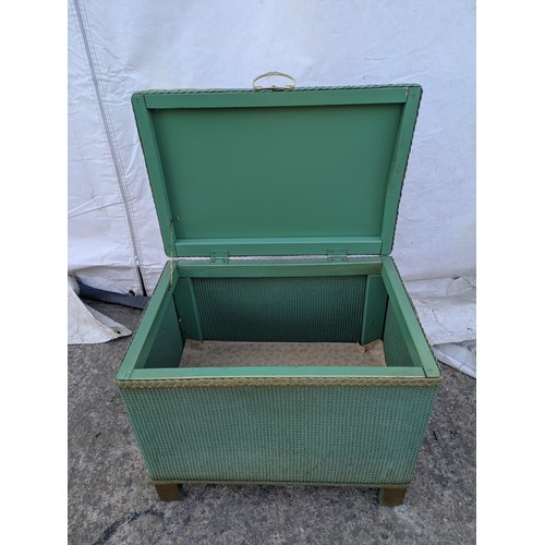 482 - A wicker storage box with a padded Florally upholstered seated top