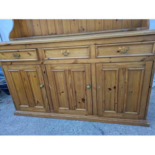 626 - A pine Welsh dresser, with a glass fronted display cabinet and underlying drawers and storage compar... 