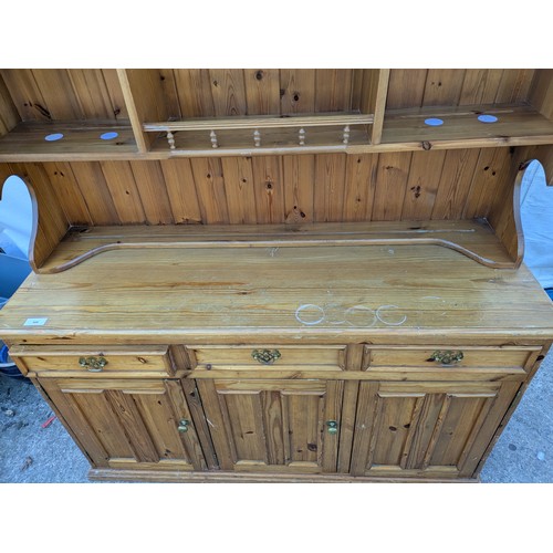 626 - A pine Welsh dresser, with a glass fronted display cabinet and underlying drawers and storage compar... 