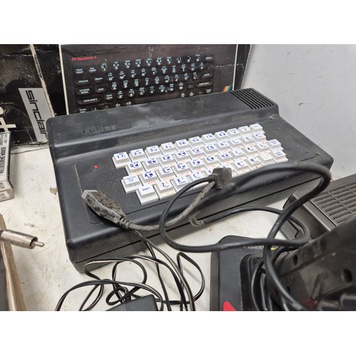 1452 - A selection of retro Sinclair ZX Spectrum equipment including boxes, games, manuals, and a Fuller sy... 