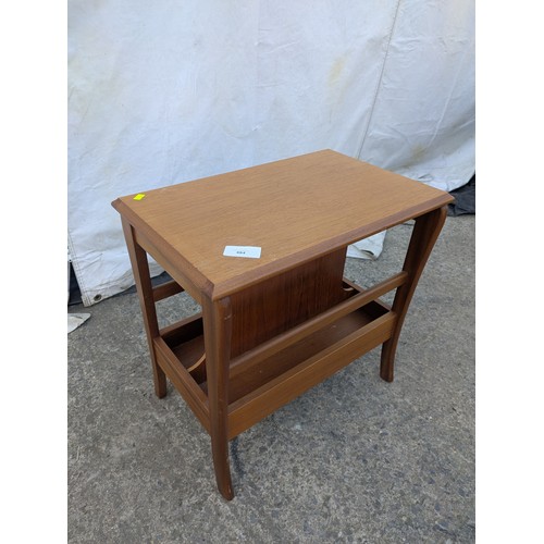 484 - A retro side table with underlying newspaper rack