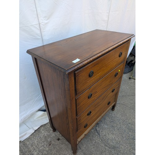 475 - A vintage oak 4 drawer chest of drawers with decorative brass handles