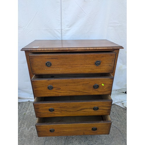 475 - A vintage oak 4 drawer chest of drawers with decorative brass handles