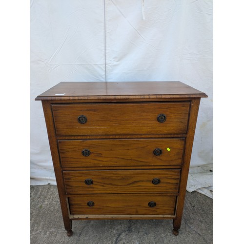 475 - A vintage oak 4 drawer chest of drawers with decorative brass handles