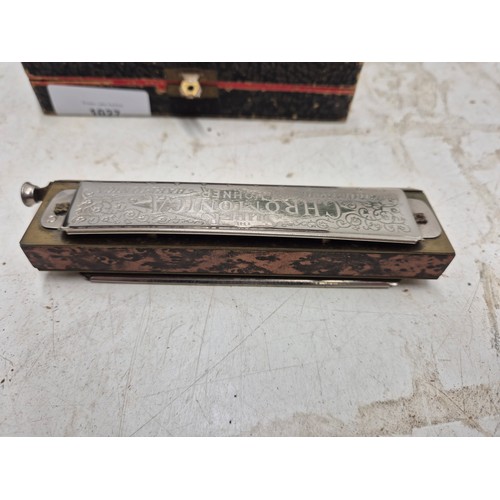 1027 - A Hohner super chromonica harmonica