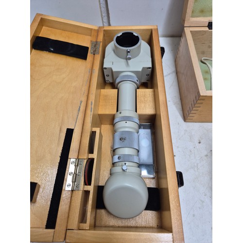 1028 - A vintage USSR biolam microscope in case with various attachments