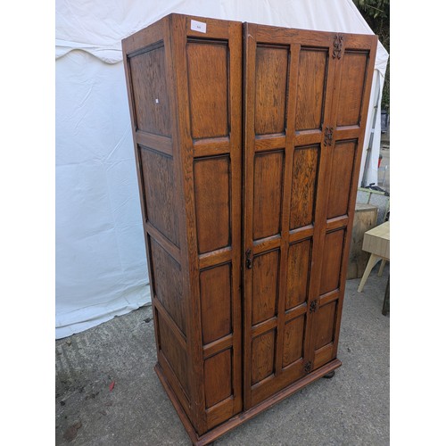 625 - A charming early 19th century wardrobe with wrought iron hinges and latches, internal dressing mirro... 