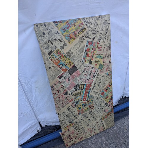 2041 - A linnmom ikea table top covered in Beano newspaper