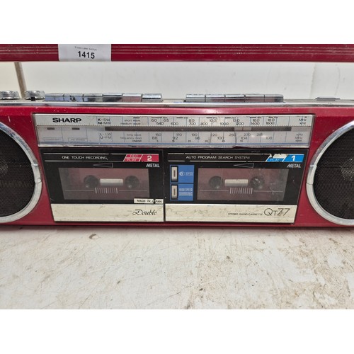 1415 - A sharp stereo radio cassette model qt77