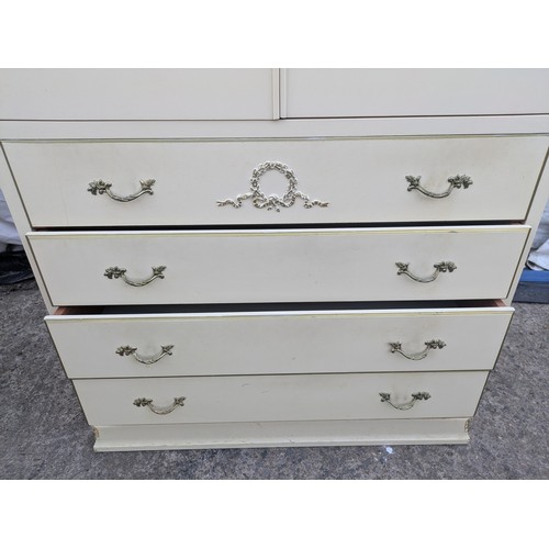 611 - An ornate renaissance style four drawer chest of drawers with storage cabinet on top.