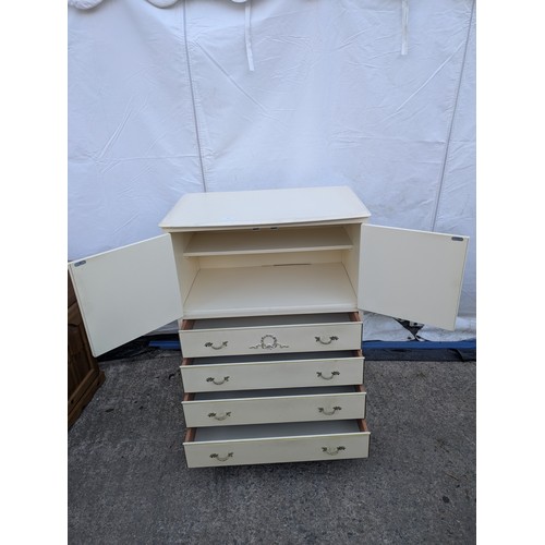 611 - An ornate renaissance style four drawer chest of drawers with storage cabinet on top.