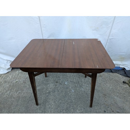 472 - A 'Beautiful-tea-table' extending dining table - centre leaf can be removed and folded out into a co... 