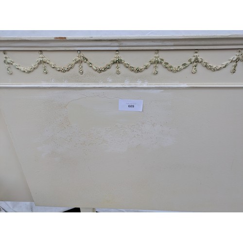 609 - An ornate renaissance style headboard with connected bedside tables.