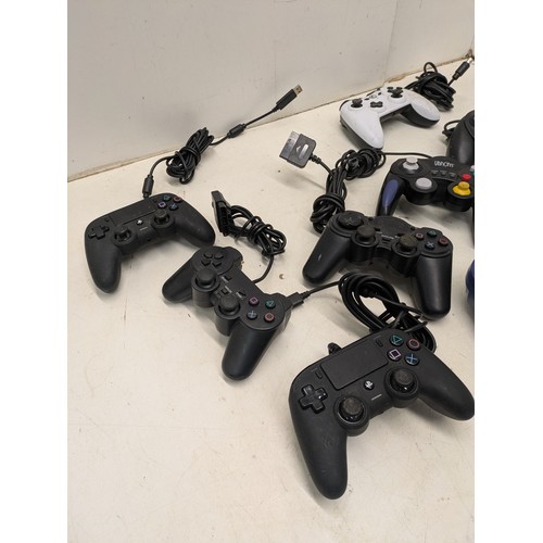 1490 - A selection of video game controllers