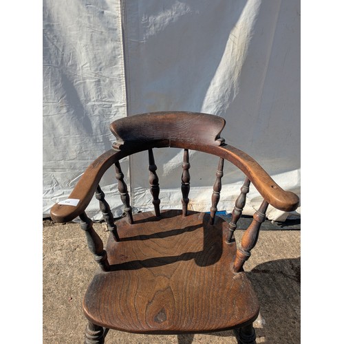 648 - An early 20th century oak captains chair