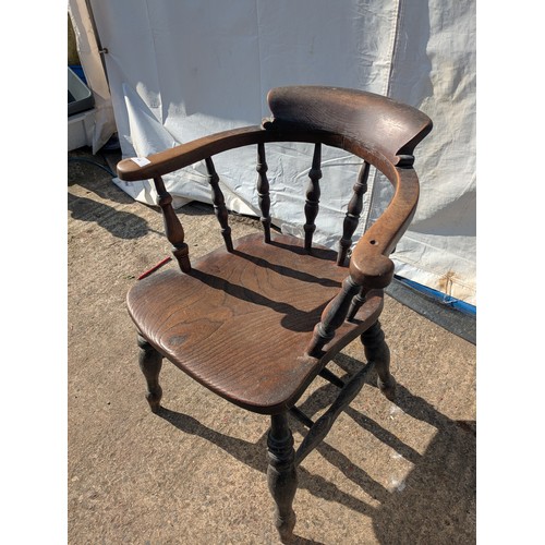 648 - An early 20th century oak captains chair